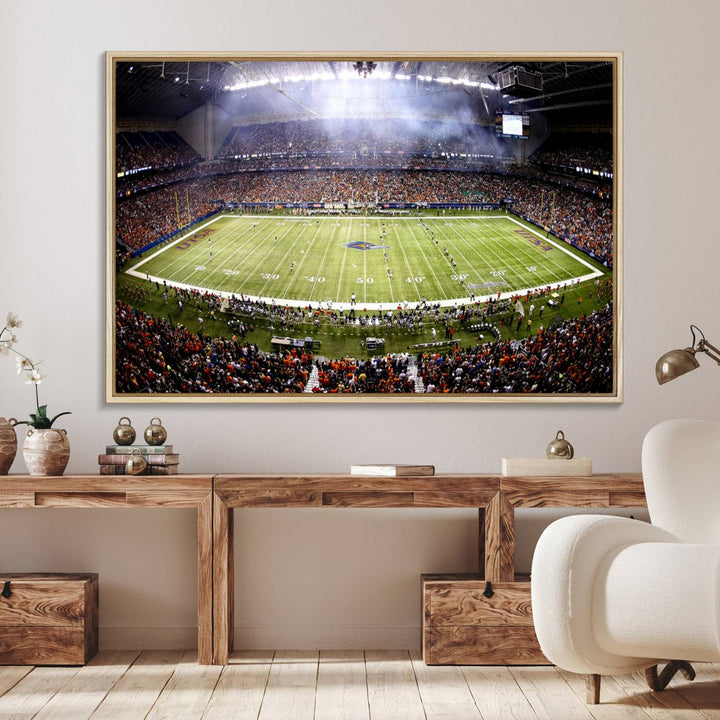 The modern living room features an Alamodome wall art canvas print, depicting a stadium filled with spectators for a UTSA Roadrunners game.