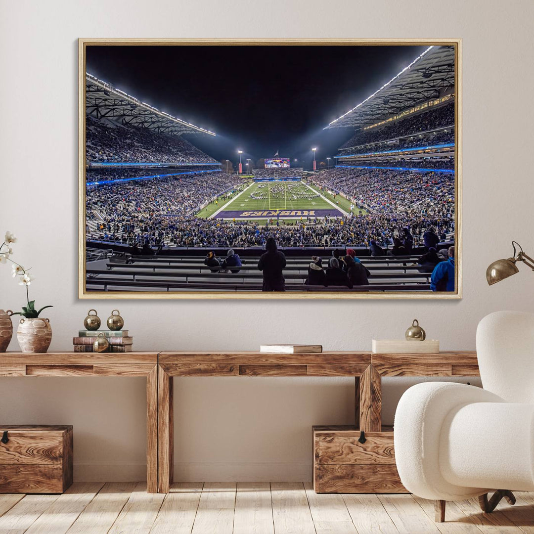 A canvas print titled The University of Washington Huskies Football depicts a packed Husky Stadium at night, as seen from the stands.