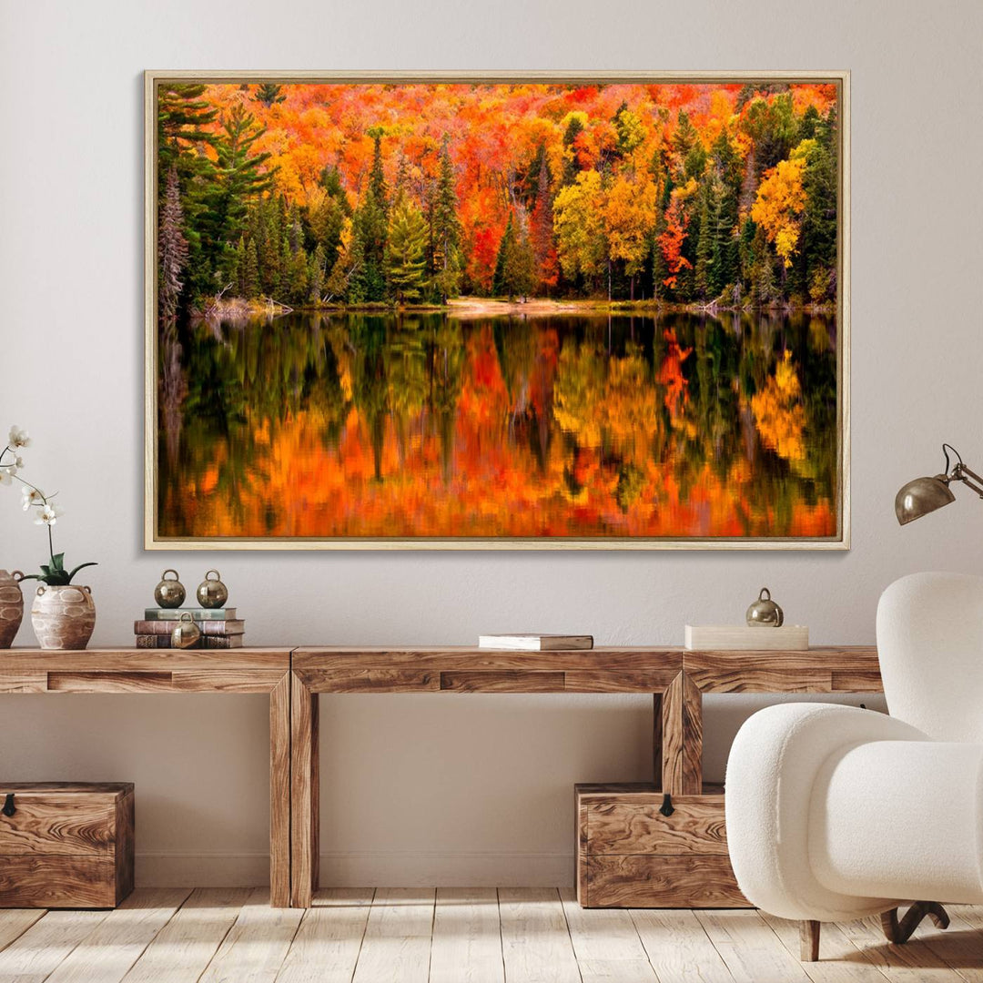 Autumn Forest Reflection Wall Art: a vibrant triptych canvas featuring fall foliage with red, orange, and yellow leaves over a calm lake.