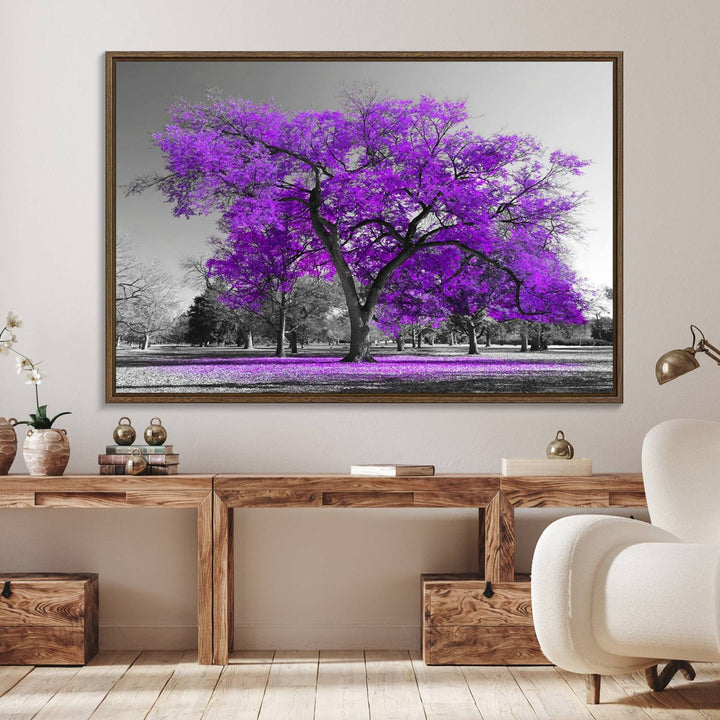 The Big Purple Tree Wall Art Canvas Print showcases a vibrant purple tree set against a black-and-white landscape.