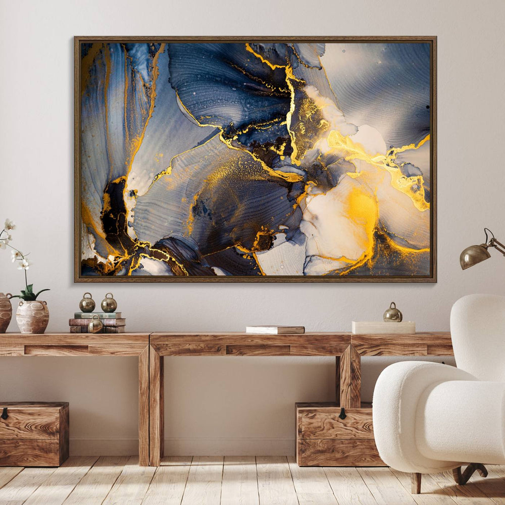 A modern luxury kitchen features a large gold and blue abstract canvas wall art print.