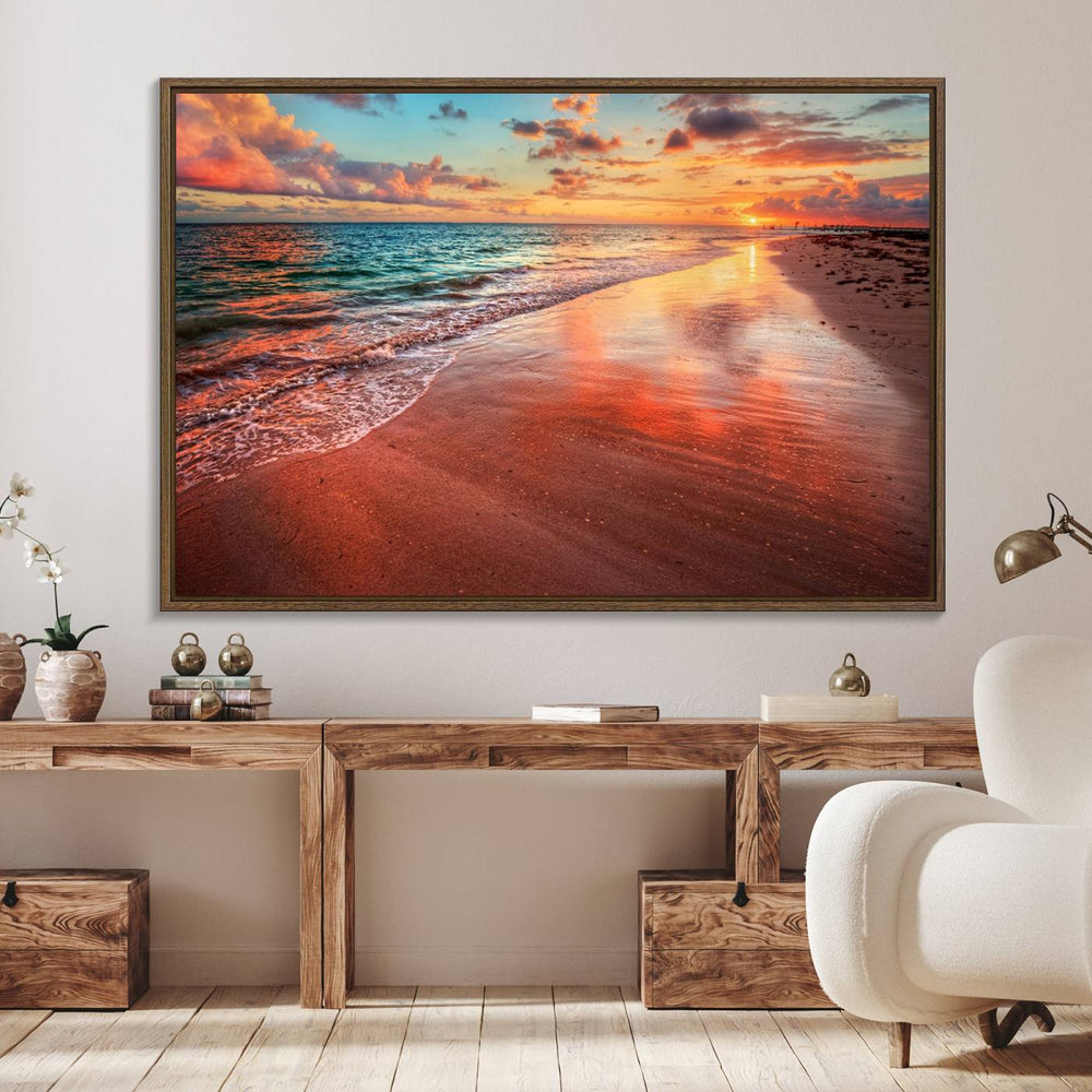 A Vibrant Sunset Beach Canvas Print with ocean waves and sandy shoreline enhances coastal-themed interiors.