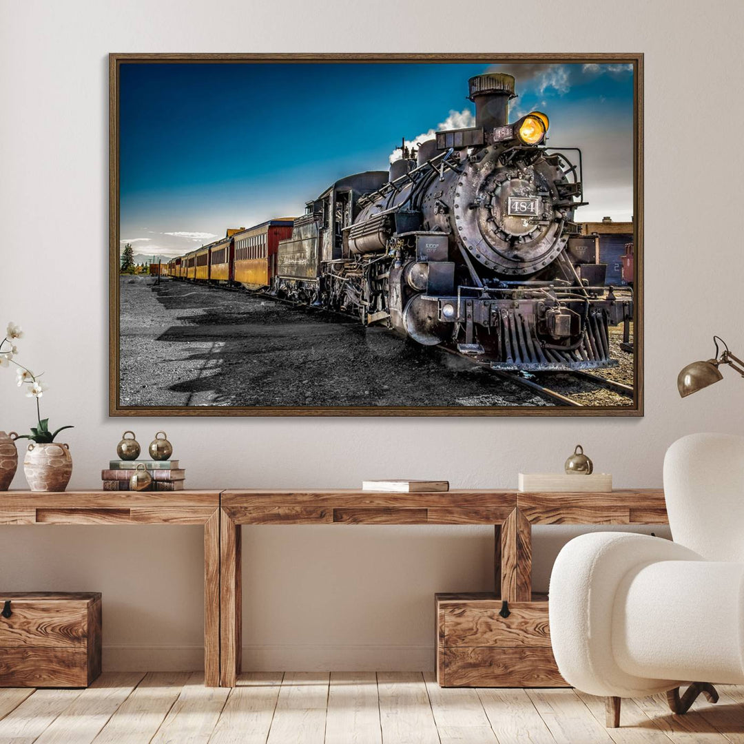 The Train Wall Art Canvas Print features a vintage steam train with a bright headlight.