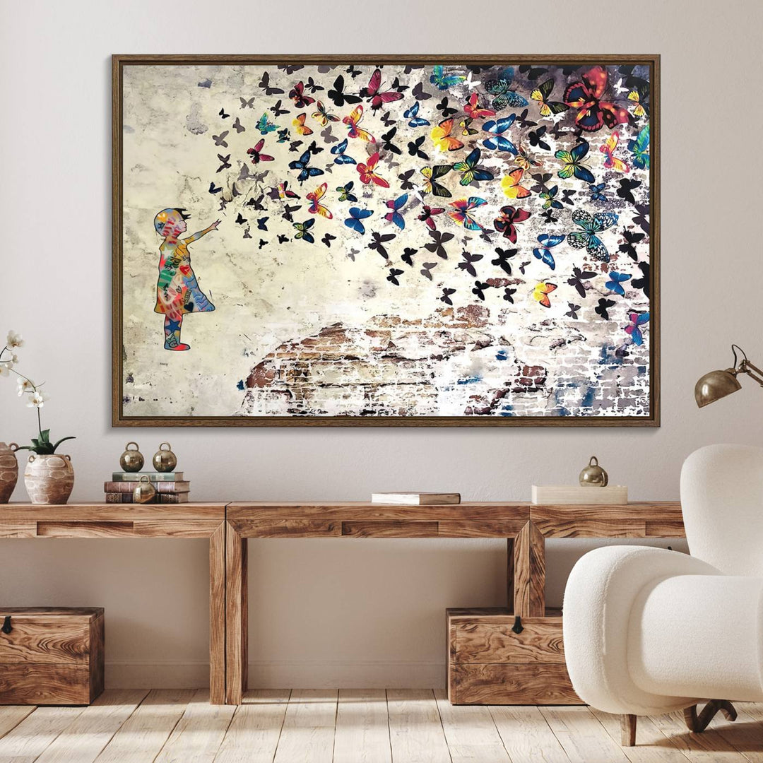 A Banksy Girl Butterfly Canvas Print is displayed on the textured wall.