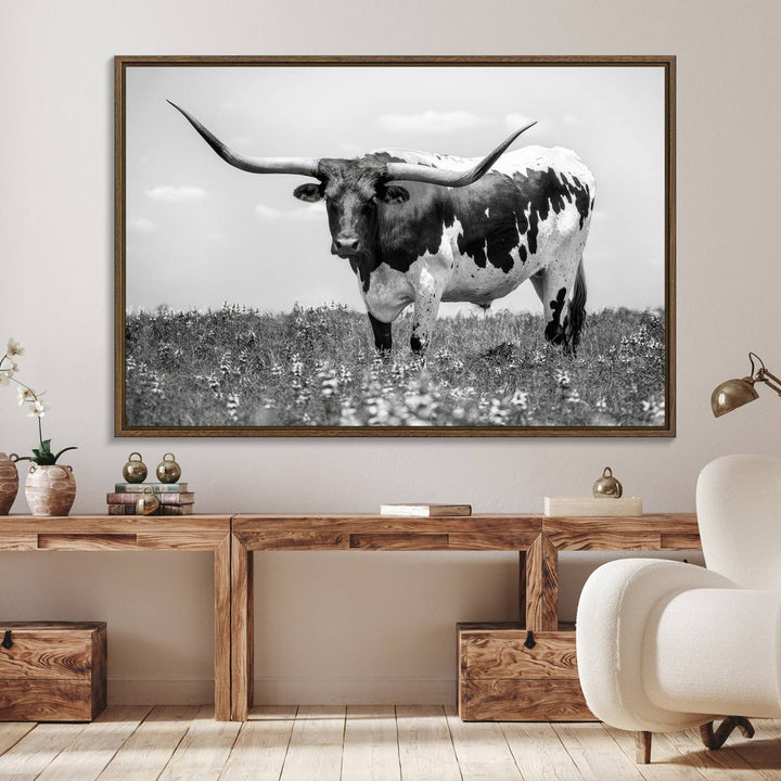 Texas Black White Highland Longhorn Cow Wall Art Canvas displayed on the wall.