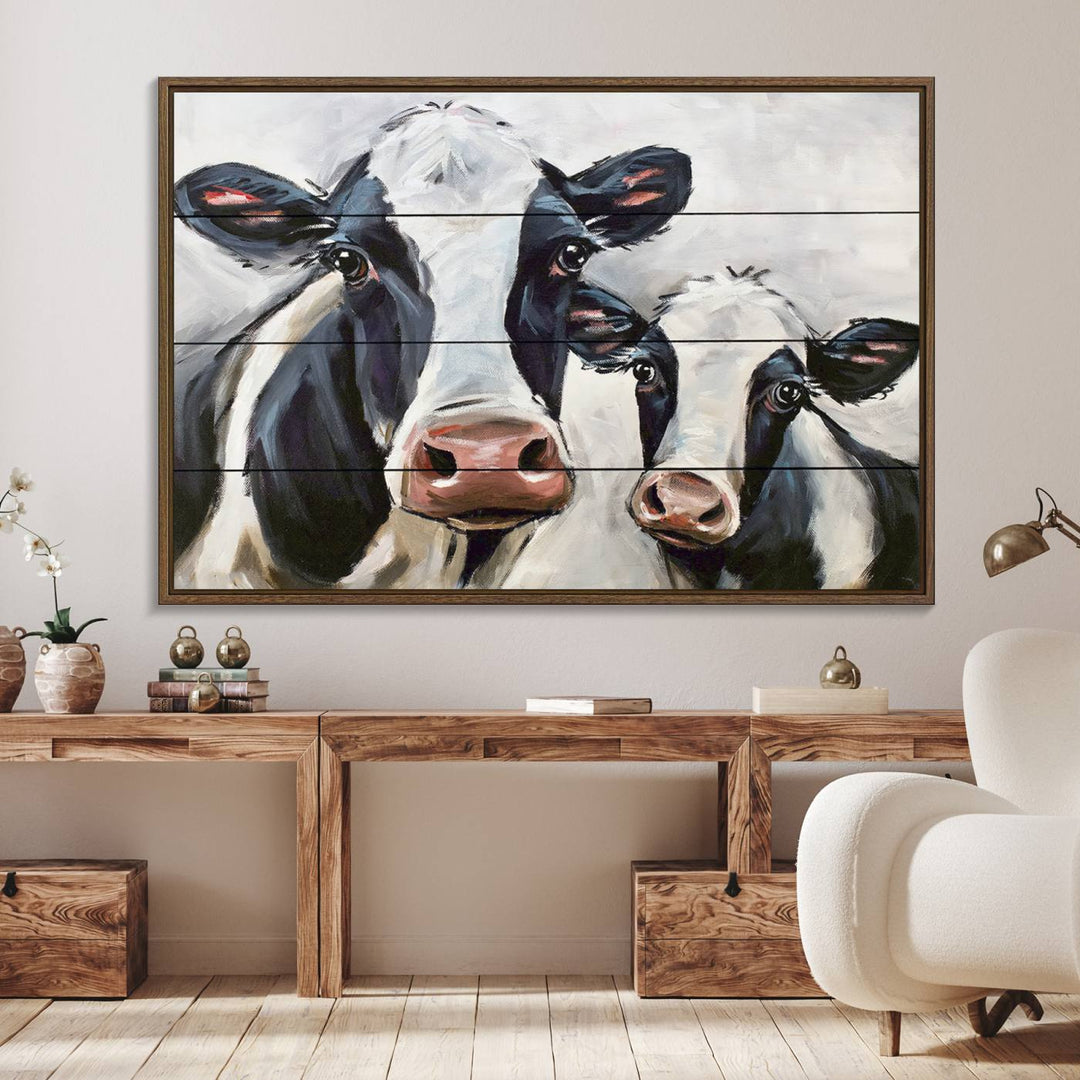 The Vintage Baby and Mom Cattle Canvas, featuring cows with black and white patches, is a prominent piece of wall art.