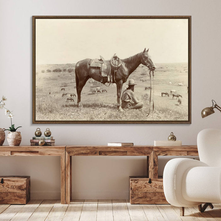 Cowboy Wall Art - Vintage Western Horse Canvas Print features a cowboy kneeling by his horse in a field.