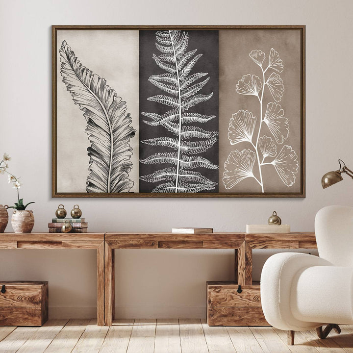 Three framed botanical wall art pieces are displayed in a bright room.