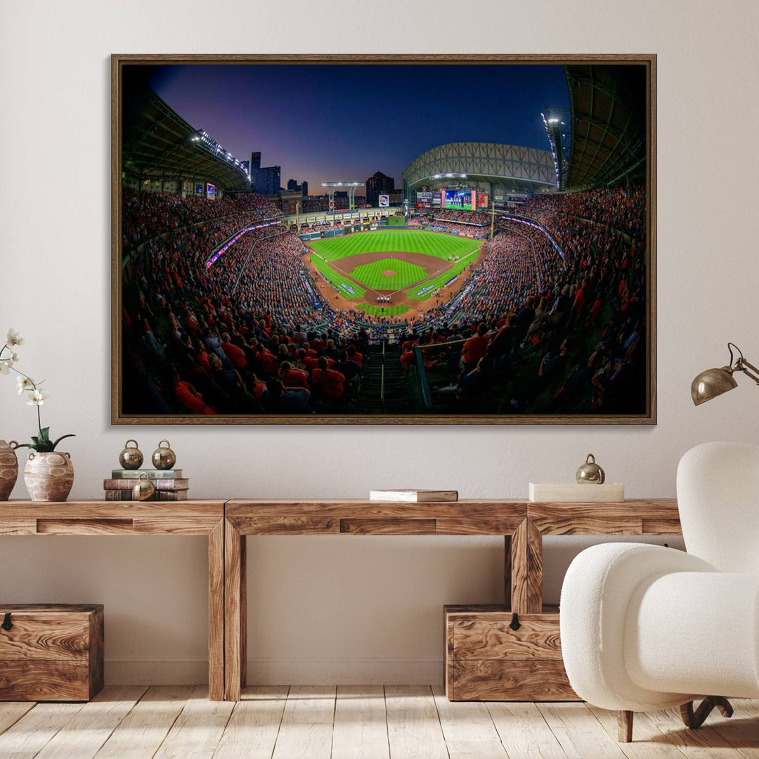 A canvas print of Houston Minute Maid Park at dusk is mounted on the wall.