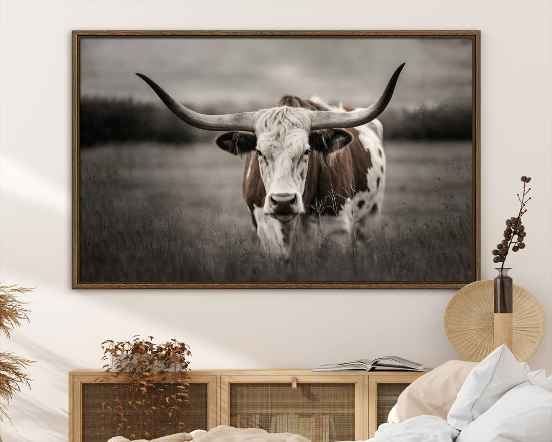 The Texas Longhorn Cow Canvas Wall Art Print adds a rustic touch to a living room.