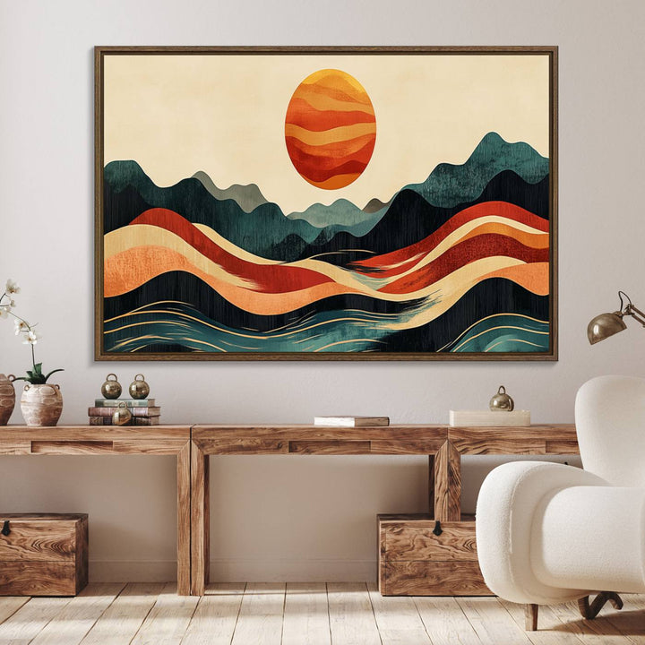 The Mountain Triptych wall art, featuring a design of the sun, mountains, and waves, is displayed prominently on the wall.