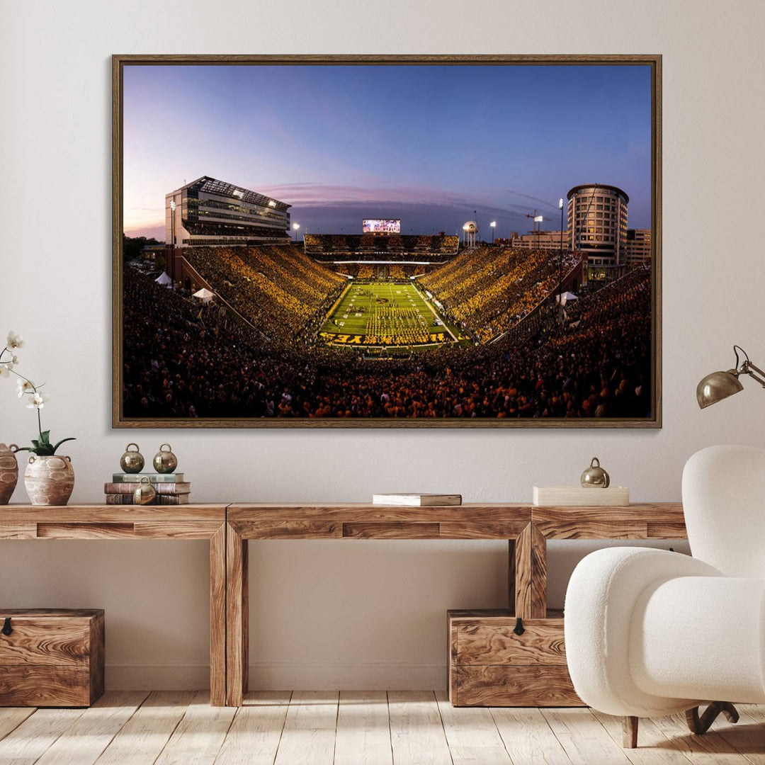 The Iowa Hawkeyes Kinnick Stadium Wall Art Canvas Print captures a sunset scene, making it perfect for display on a wall.