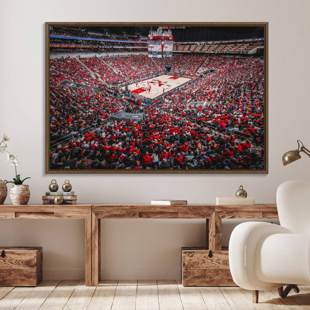 A painting of Louisville Cardinals fans in red at the KFC Yum Center Arena.