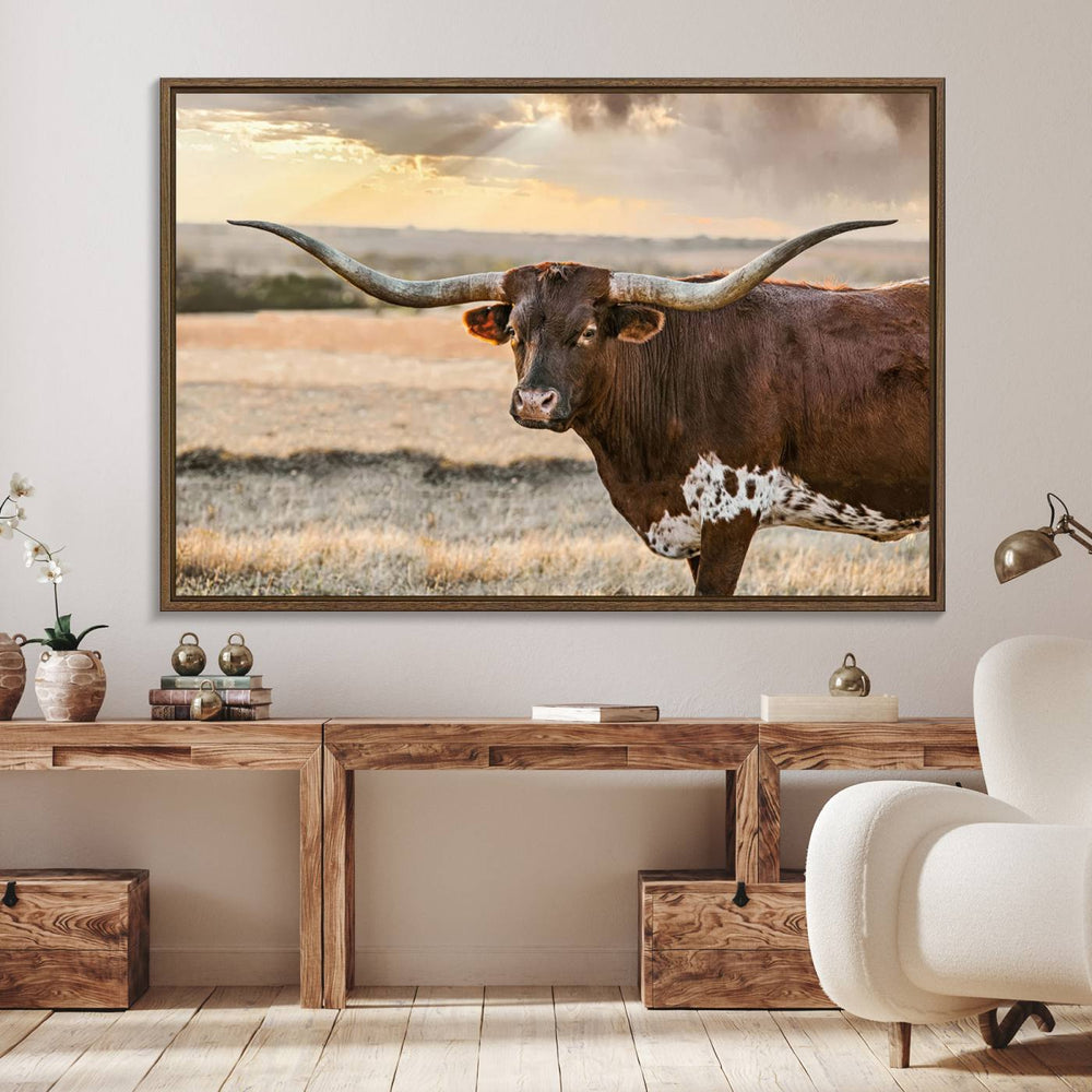 The Texas Longhorn Wall Art Canvas Print depicts a large Texas Longhorn with impressive horns standing at sunset.