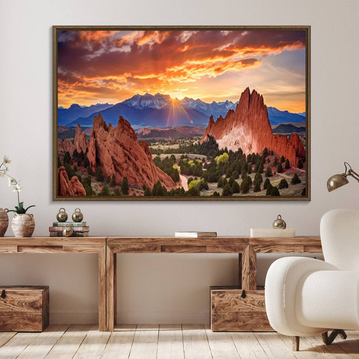 A vibrant sunset over the Rocky Mountains with red rocks.