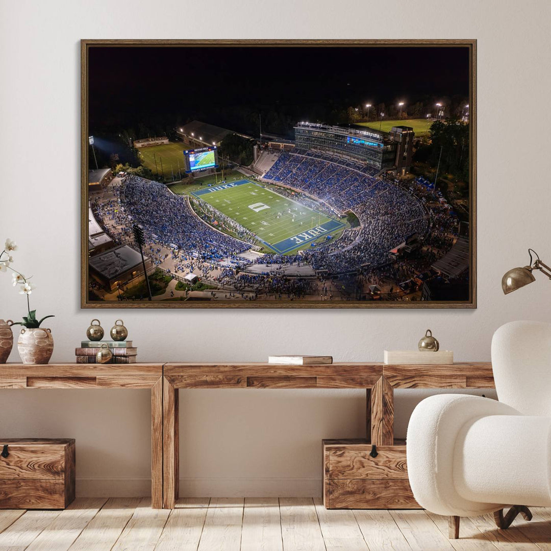 Night aerial view of packed Duke Blue Devils Wallace Wade Stadium, surrounded by trees and illuminated by lights; perfect for high-resolution prints.