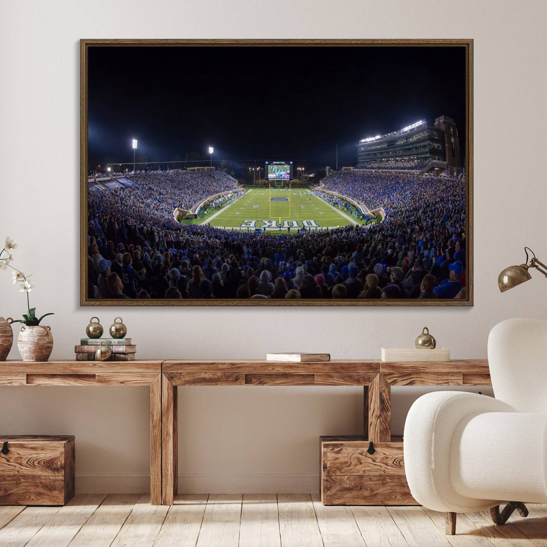 Under bright lights at night, the Duke Blue Devils Football Team Durham canvas wall art print is prominently displayed.