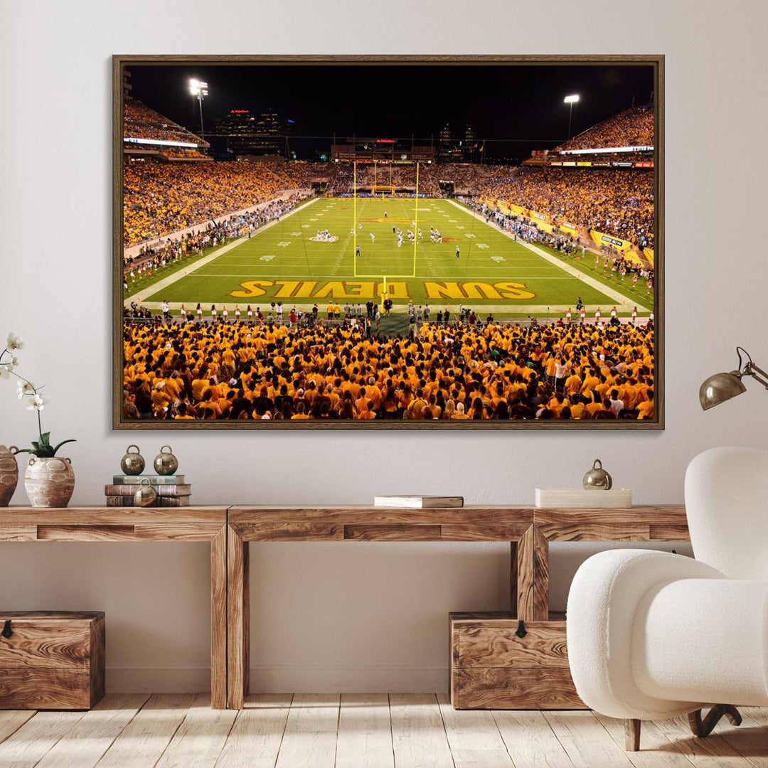 The Phoenix Stadium Canvas Wall Art features a vibrant depiction of a packed stadium filled with ASU Sun Devils fans wearing yellow shirts.