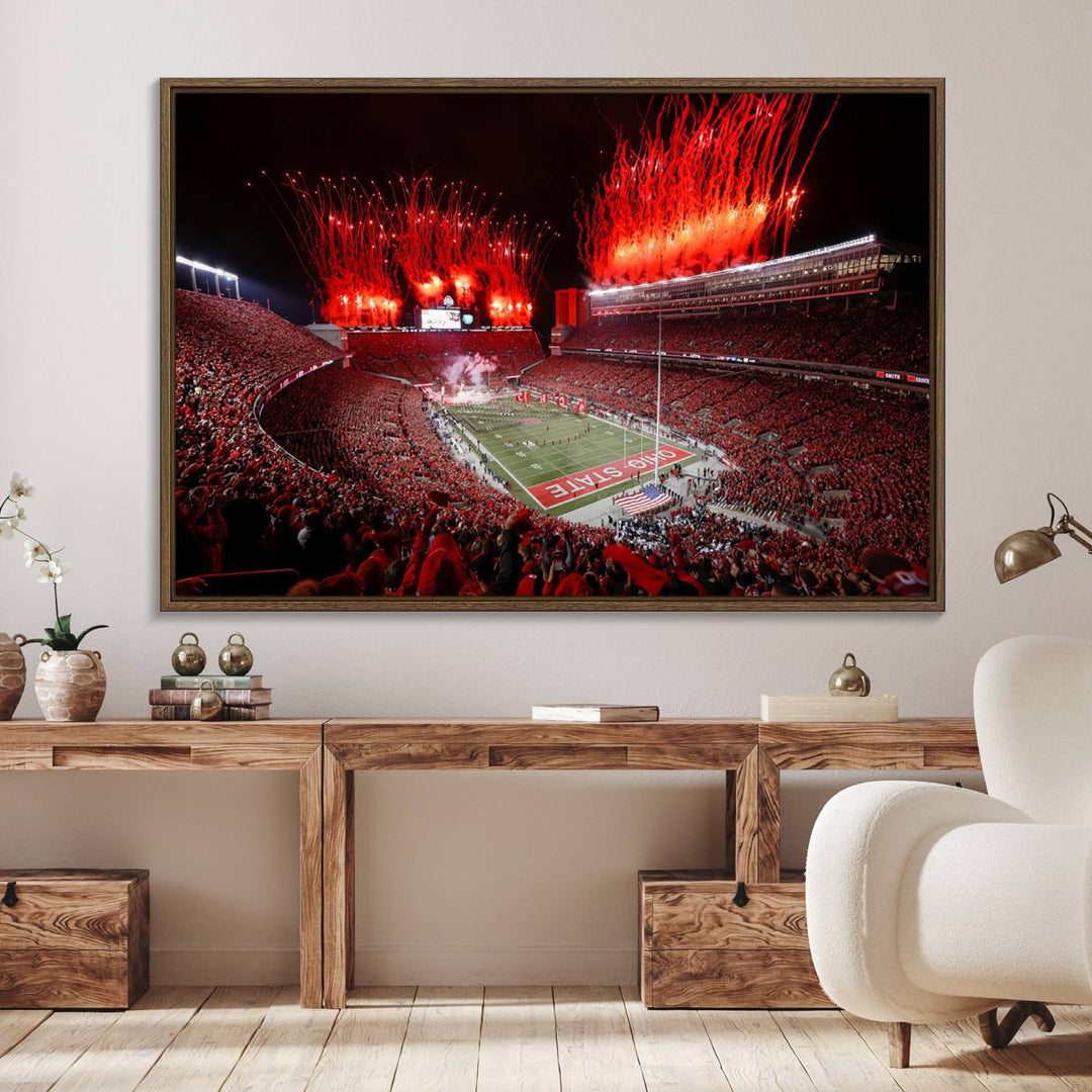 A vibrant red canvas art of a packed Ohio State Buckeyes stadium at night with fireworks.