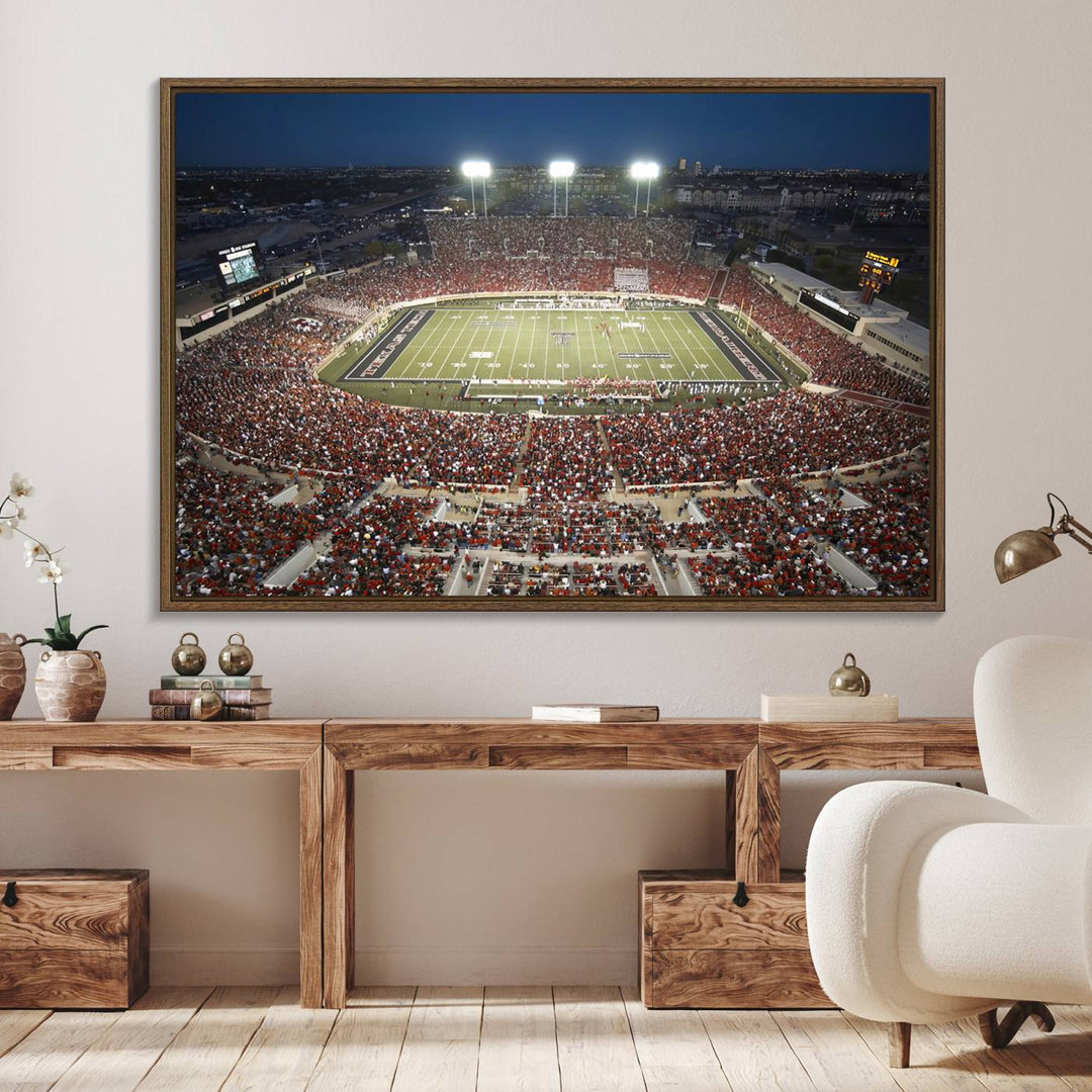 Canvas wall art featuring an aerial view of the Texas Tech Red Raiders packed night game at Lubbock’s Jones AT&T Stadium.