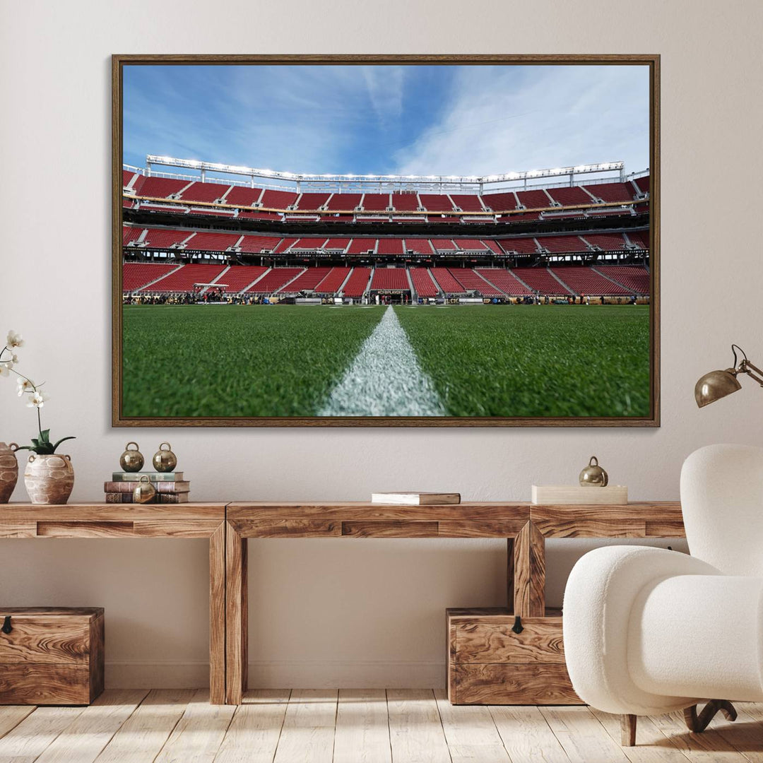 A canvas print of the University of Tulsa Golden Hurricane showcases H.A. Chapman Stadiums football field and red seats against a backdrop of a blue sky.