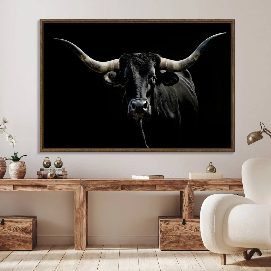 A captivating close-up canvas print of a Texas Black Longhorn with impressive curved horns set against a dark backdrop, ideal as a standout piece in your collection of Longhorn Cow Wall Art.