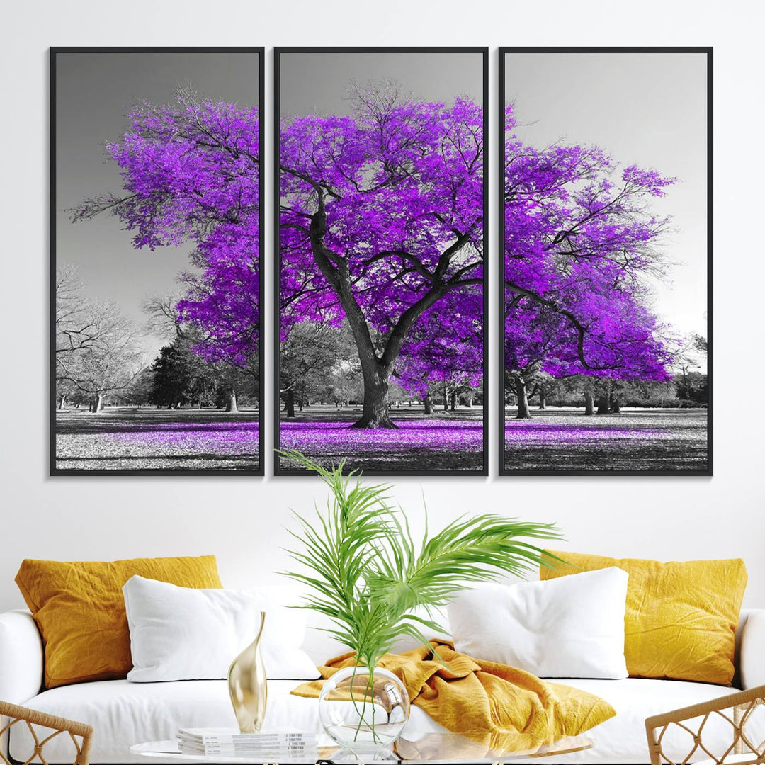 The Big Purple Tree Wall Art Canvas Print showcases a vibrant purple tree set against a black-and-white landscape.