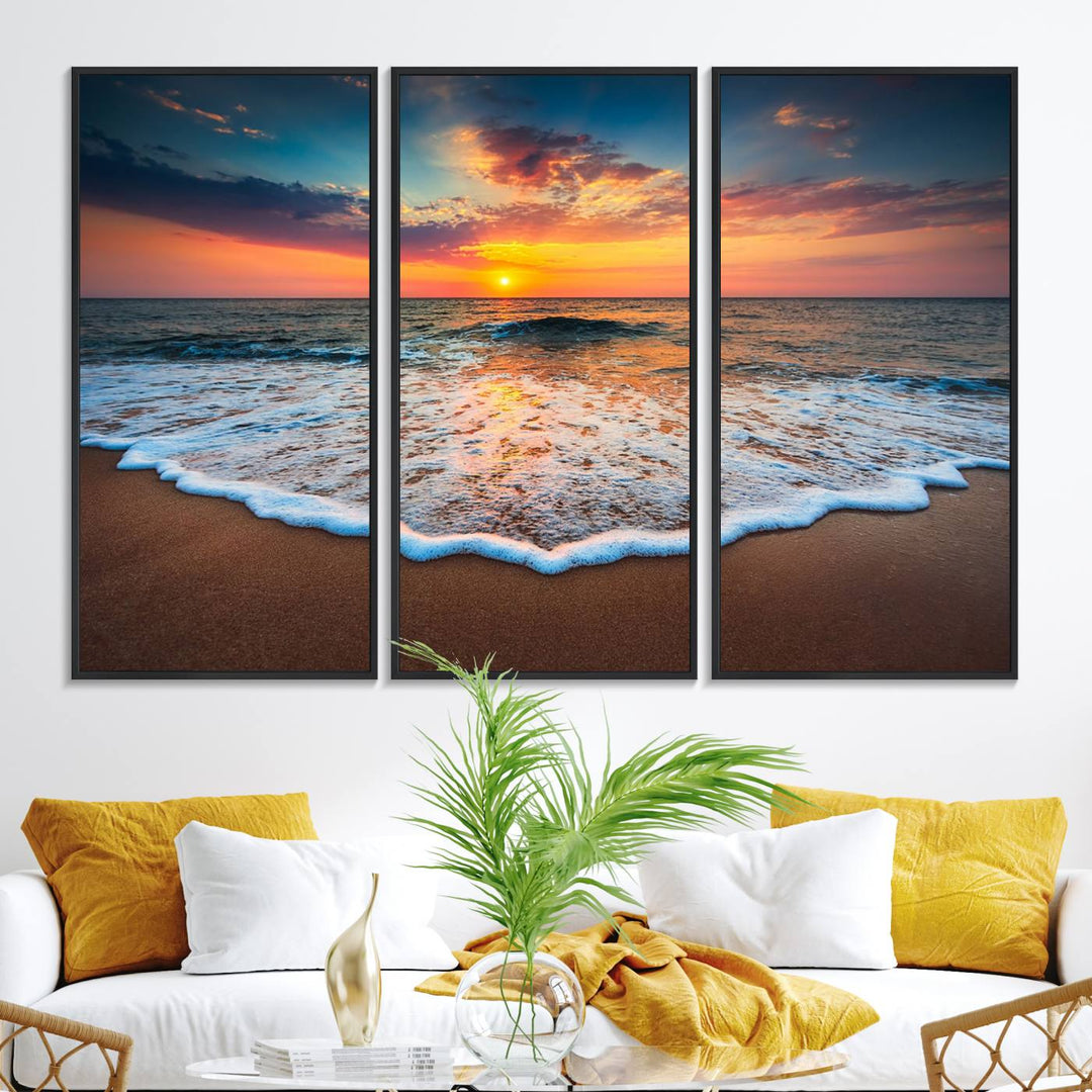 A Sunset with Calm Waves on the Beach Wall Art Canvas Print adorns the dining room.