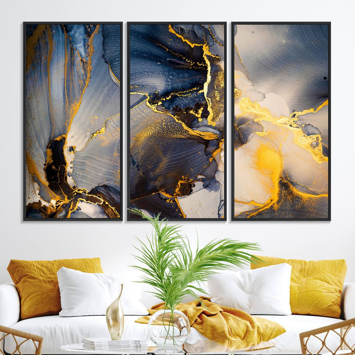A modern luxury kitchen features a large gold and blue abstract canvas wall art print.