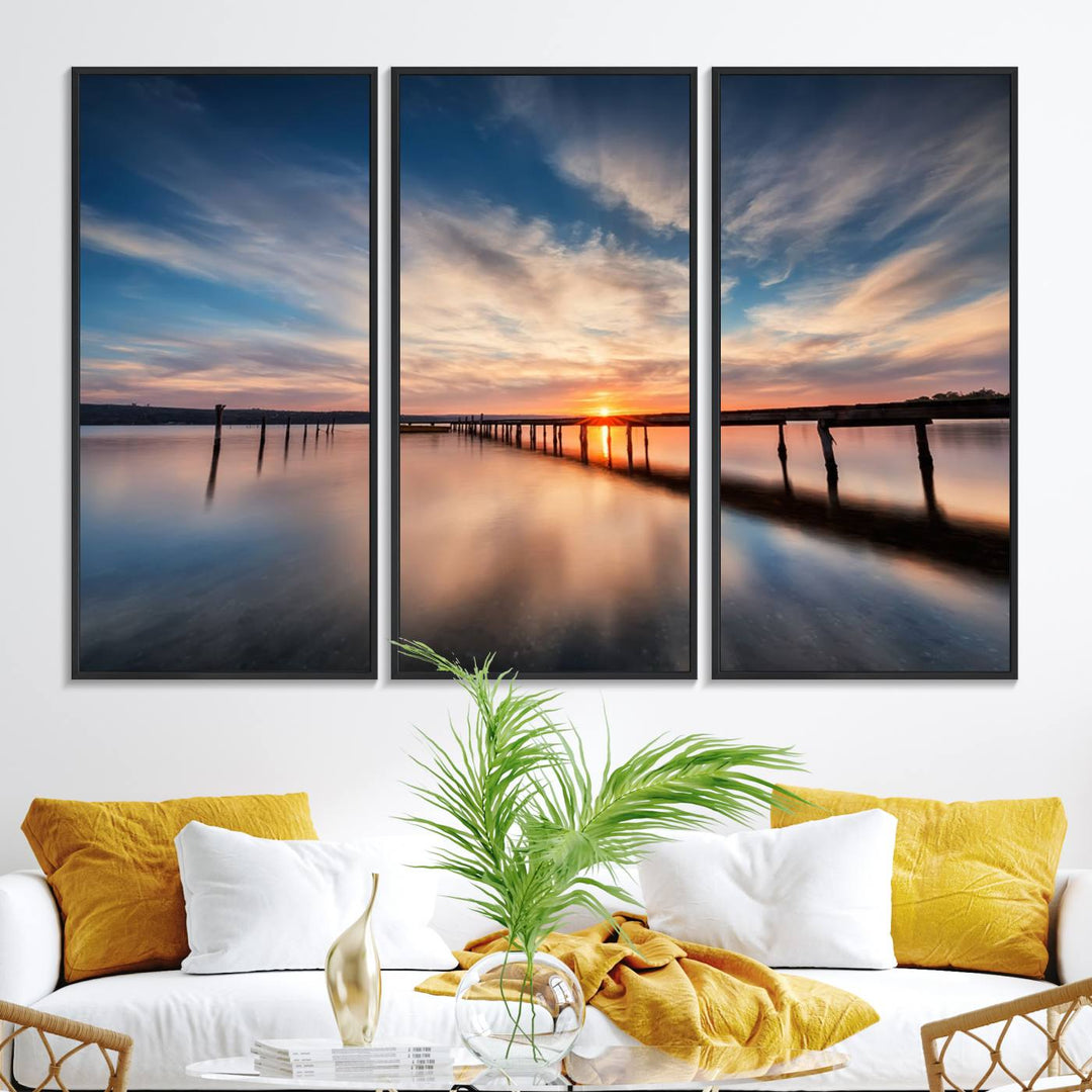 The Sunset Pier Canvas features a serene coastal landscape with vibrant hues under cloudy skies, ideal for modern decor.