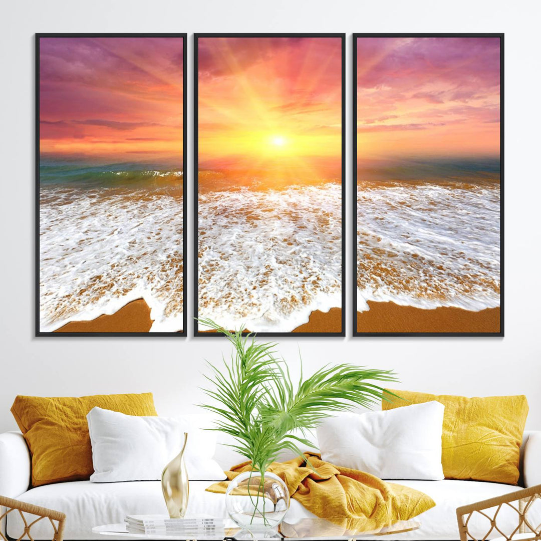 Golden Beach Sunrise 3-panel canvas art of ocean waves, hung on a wooden wall.