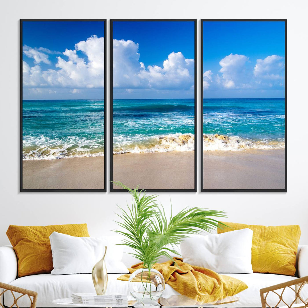 The Tropical Beach 3-Panel Canvas Wall Art features ocean waves gently lapping on a beach under blue skies, making it an ideal choice for coastal decor.