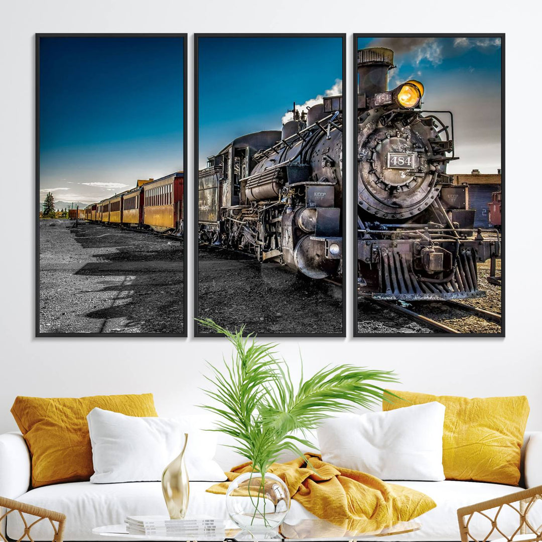 The Train Wall Art Canvas Print features a vintage steam train with a bright headlight.