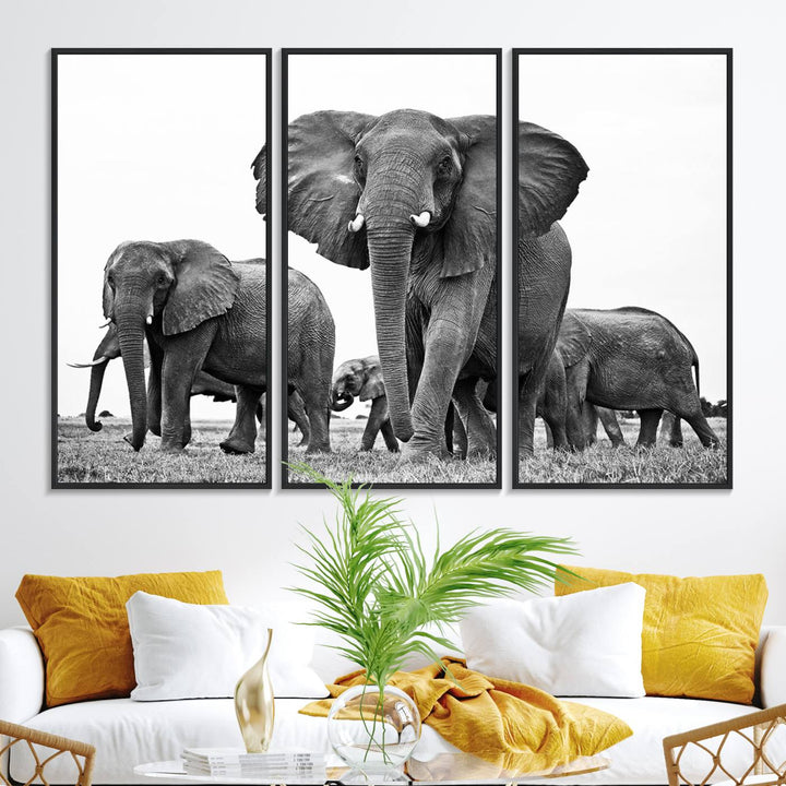 A modern dining area features a Black White Elephant Family Wall Art Canvas Print.