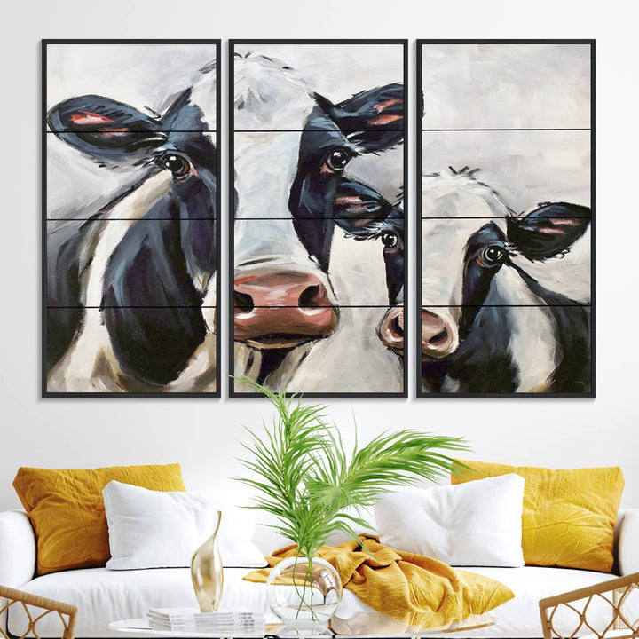 The Vintage Baby and Mom Cattle Canvas, featuring cows with black and white patches, is a prominent piece of wall art.