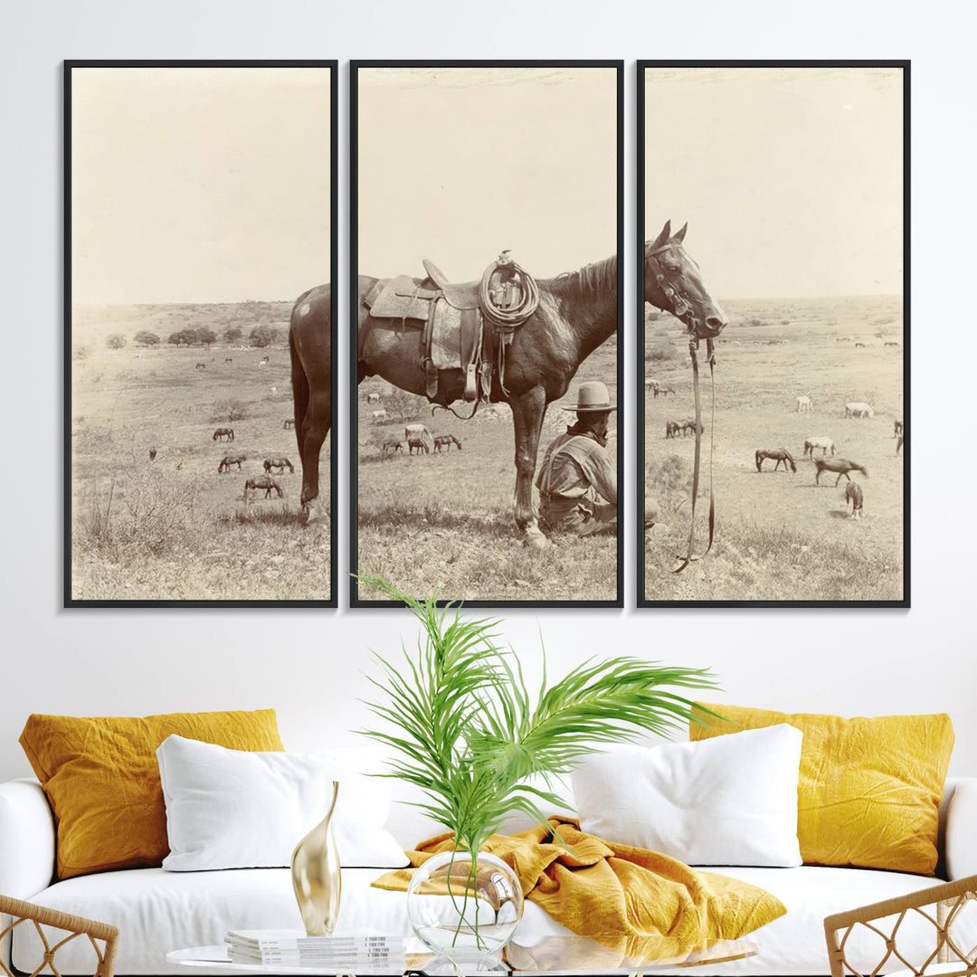 Cowboy Wall Art - Vintage Western Horse Canvas Print features a cowboy kneeling by his horse in a field.