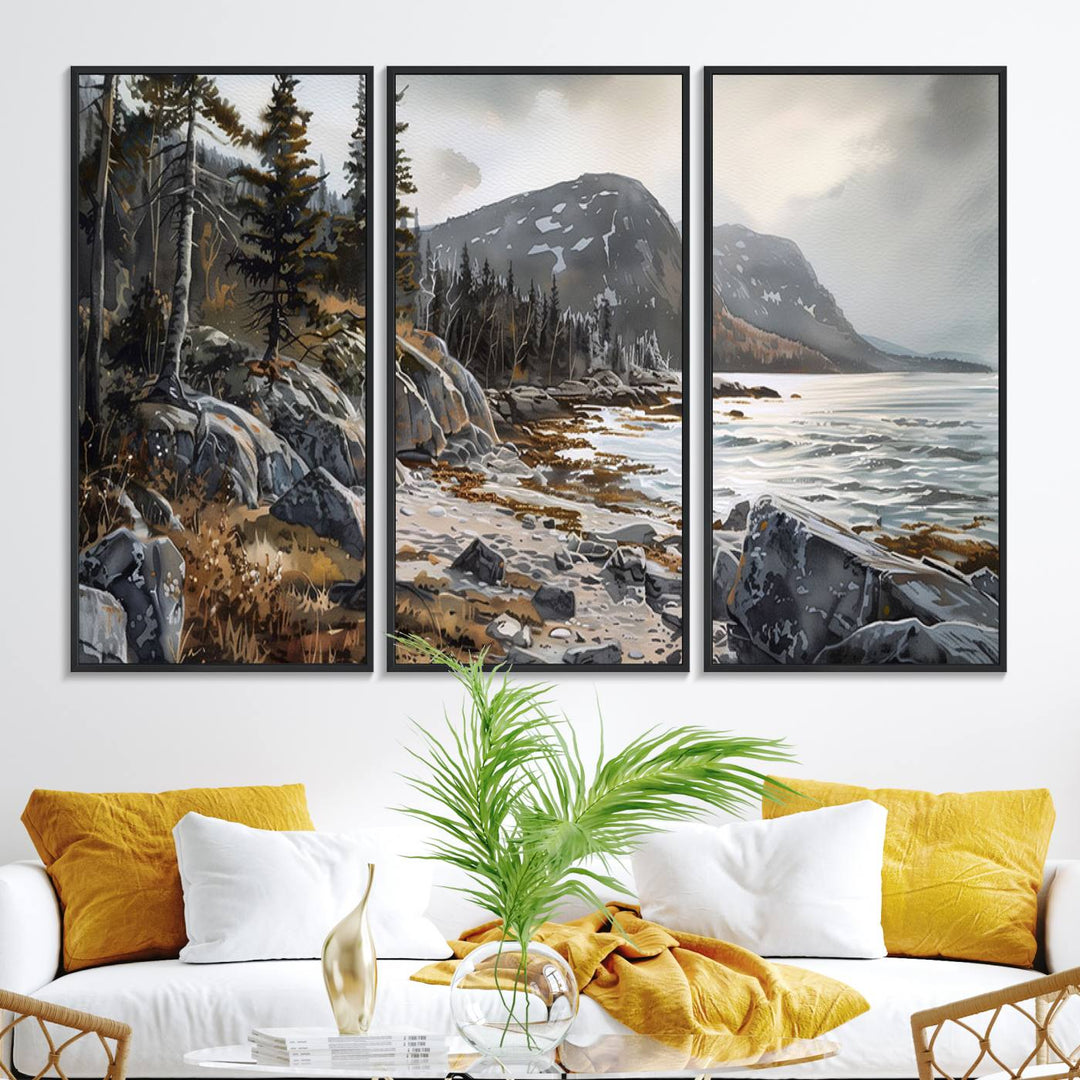 Framed wall art depicting Acadia National Parks rocky coast, trees, mountains, and sunlight over the sea; ready to hang.