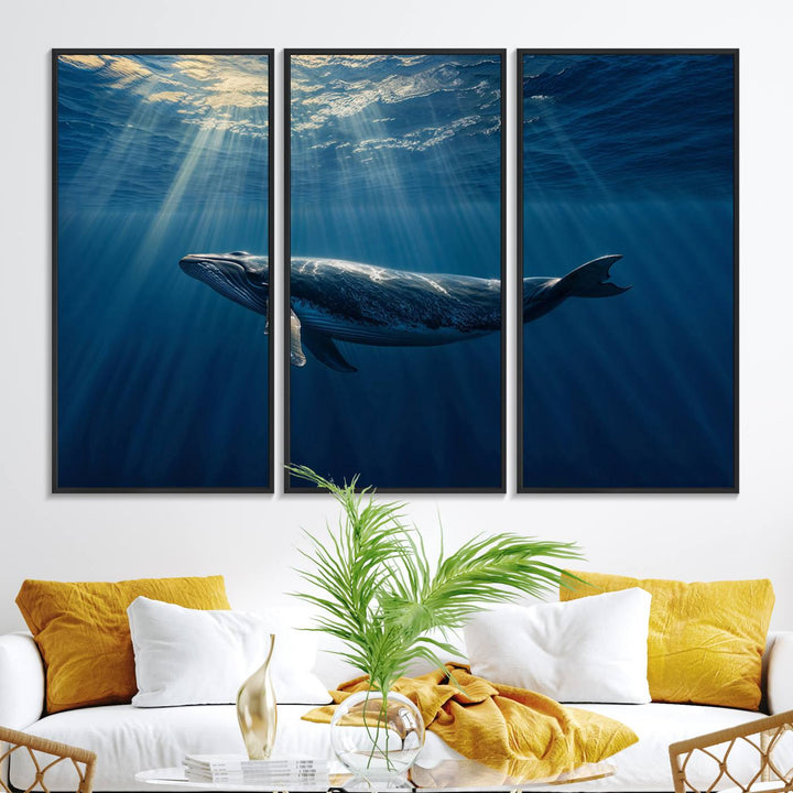 The Whale under Ocean wall art canvas print graces the white wall.