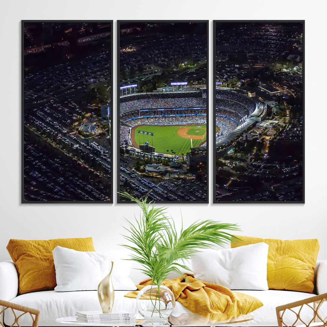 A large Los Angeles Dodgers print of Dodger Stadium at night is displayed near a window.