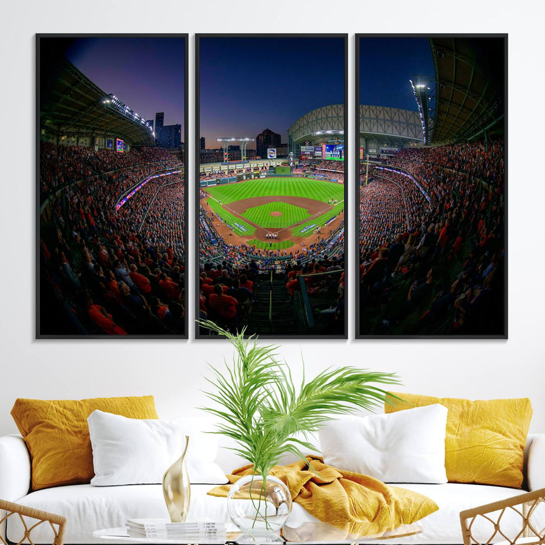 A canvas print of Houston Minute Maid Park at dusk is mounted on the wall.