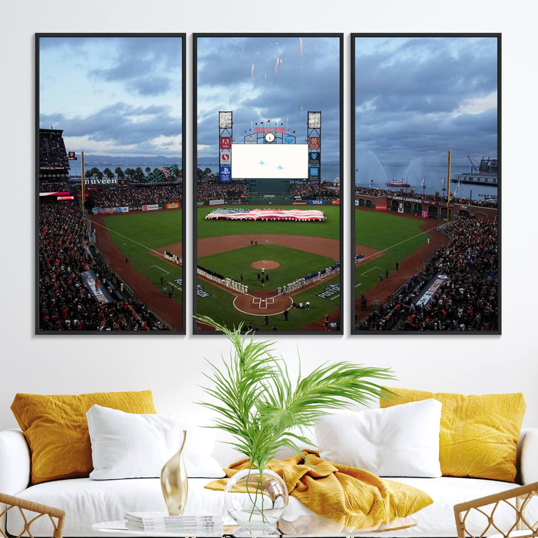 This framed 3-panel canvas MLB wall art features a giant flag and fans under a cloudy sky at Oracle Park.