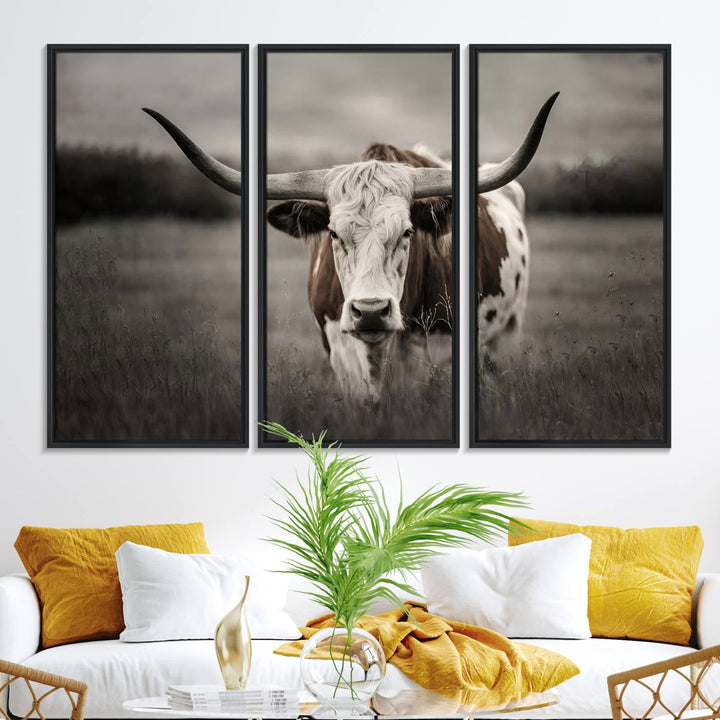 The Texas Longhorn Cow Canvas Wall Art Print adds a rustic touch to a living room.