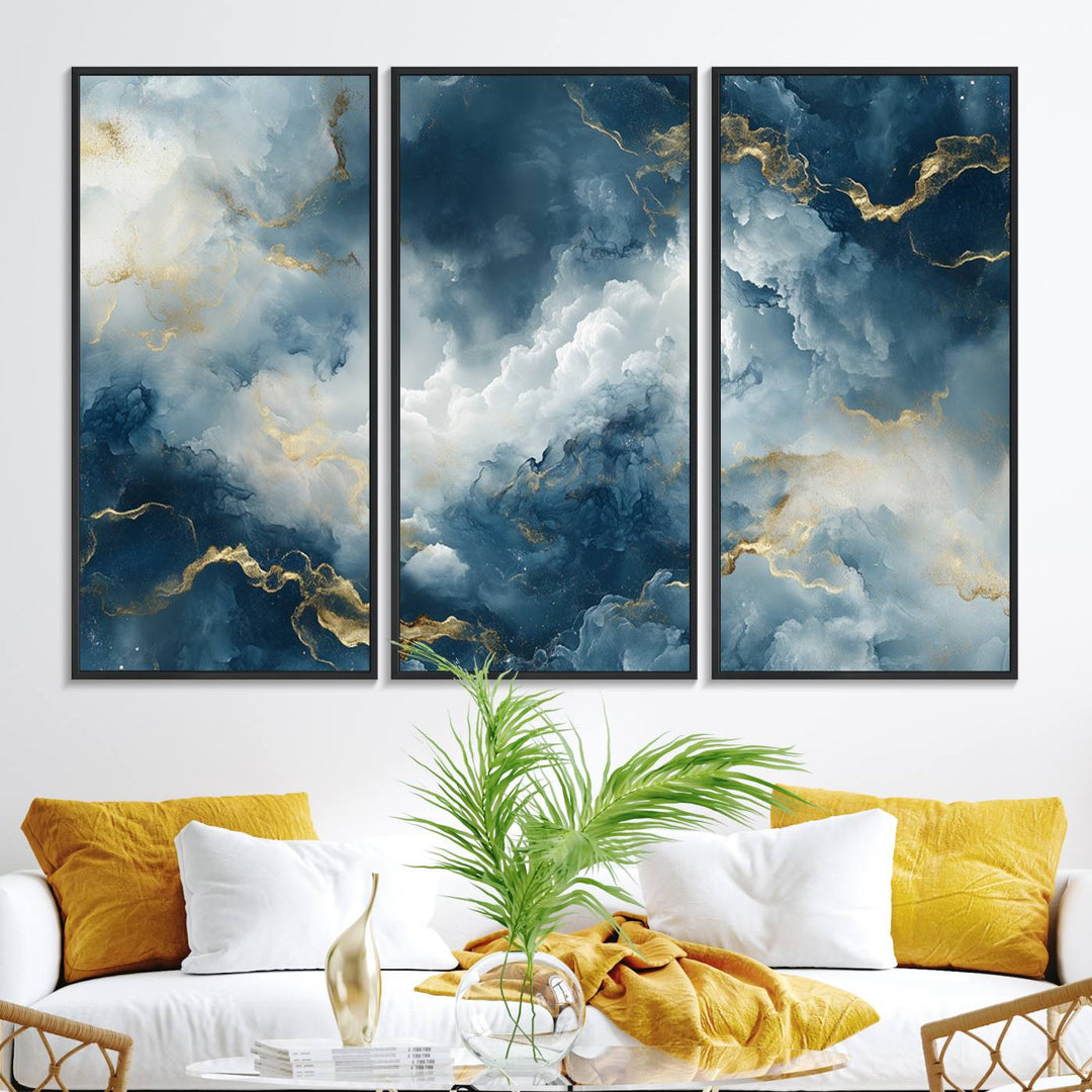 The "Large Abstract Print - Luxe Blue and Gold Abstract Canvas Wall Art" features a bold cloudscape design with swirling white patterns, ideal for modern home decor in living rooms or offices.