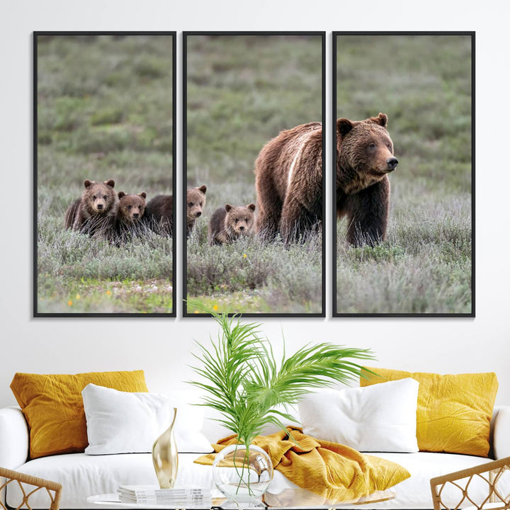 The large canvas print titled "Queen of the Tetons, 399 Grizzly Bear Cubs" showcases majestic wildlife photography of a bear and her cubs walking through the grass. This stunning canvas wall art, handmade in the USA, adds a charming touch to any room with its rustic decor appeal.