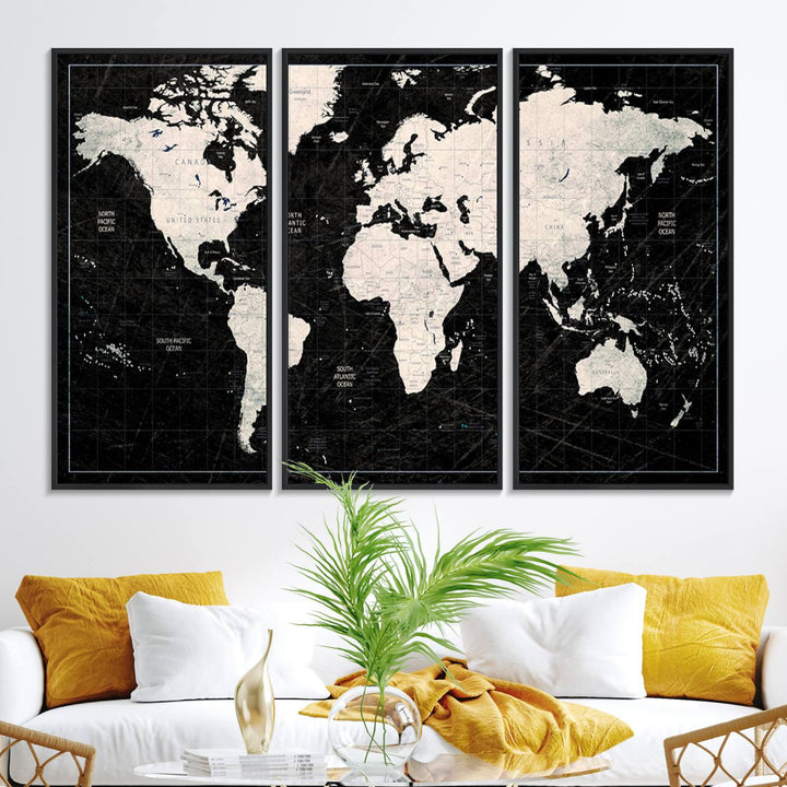 The Black & White World Map Canvas Wall Art, a giclee print, elegantly decorates the wall.