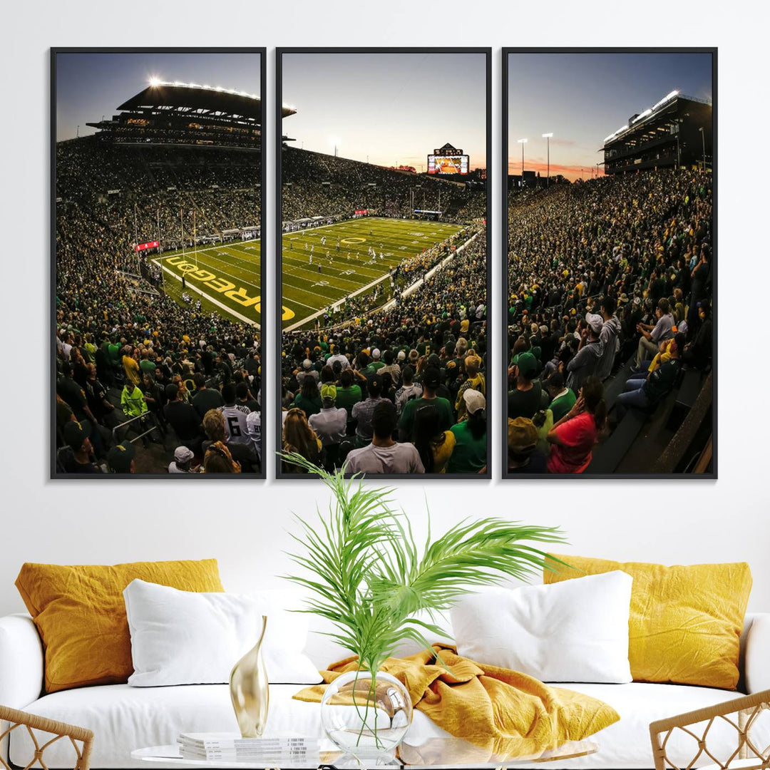 The Oregon Stadium Canvas Wall Art features a depiction of a packed Autzen Stadium with OREGON prominently displayed on the field.