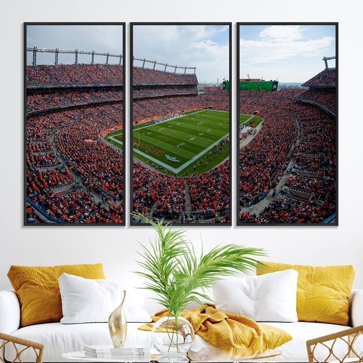 The Denver Broncos Football Print features a vibrant, fan-filled orange stadium overlooking the football field.