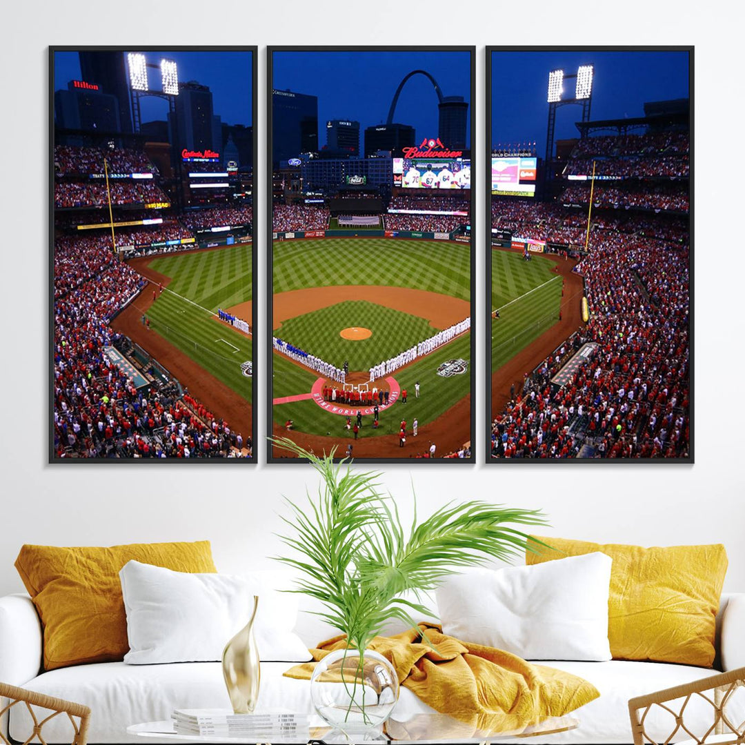 A Cardinals wall art canvas print depicts Busch Stadium with players lined up on the field and a full audience under the lights, capturing the vibrant atmosphere.