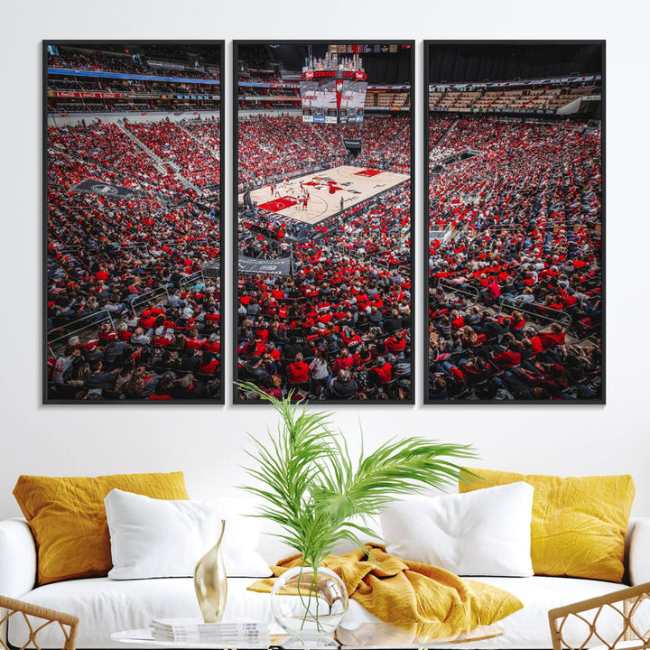 A painting of Louisville Cardinals fans in red at the KFC Yum Center Arena.