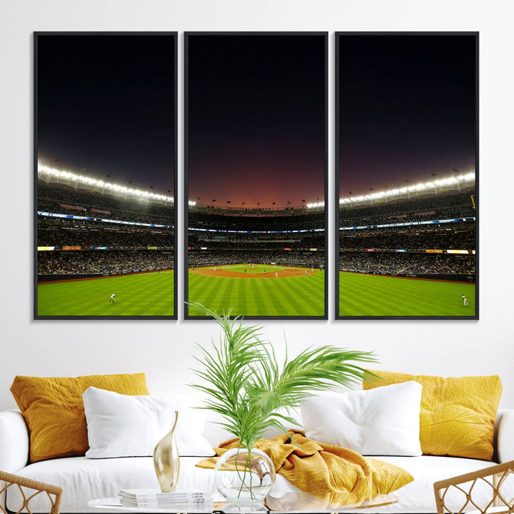 A night game at Yankee Stadium depicted on canvas beneath a sunset sky.